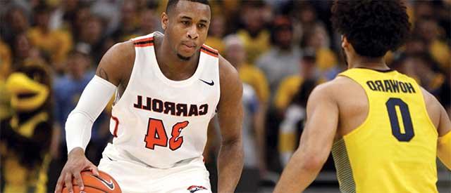 Ray Pierce playing in a basketball game against Marquette University